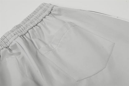 DAXUEN Wide-leg track pants with geometric color-blocked panels