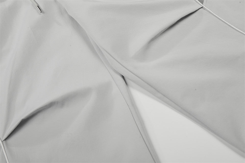 DAXUEN Wide-leg track pants with geometric color-blocked panels