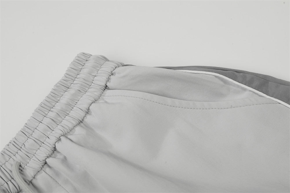 DAXUEN Wide-leg track pants with geometric color-blocked panels