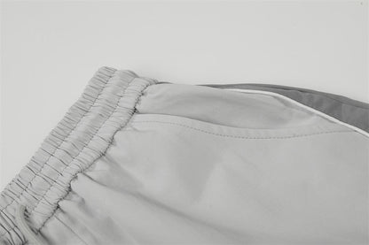 DAXUEN Wide-leg track pants with geometric color-blocked panels