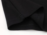 DAXUEN Embroidered graphic polo shirt in black and light grey marl