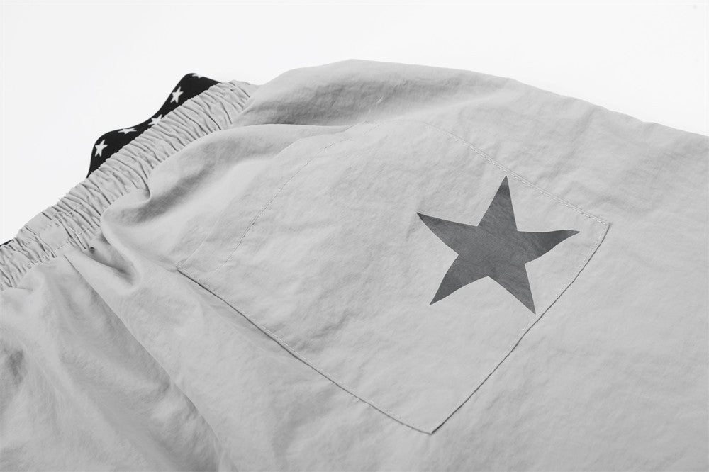 DAXUEN Wide-leg track pants with star graphics
