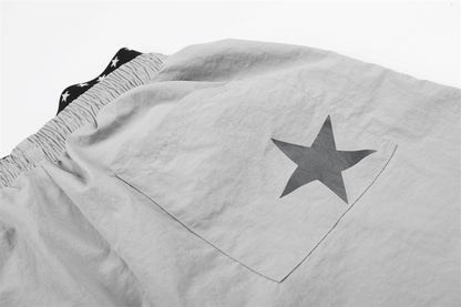 DAXUEN Wide-leg track pants with star graphics