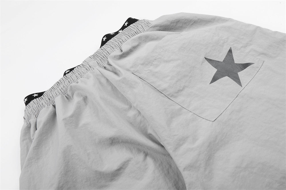 DAXUEN Wide-leg track pants with star graphics