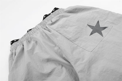 DAXUEN Wide-leg track pants with star graphics