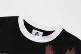 DAXUEN Distressed graphic ringer T-shirt with ribbed collar and cuffs