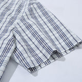 DAXUEN Short-sleeved plaid button-up shirt