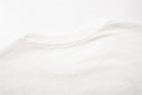 DAXUEN Light cream graphic T-shirt with chaotic print