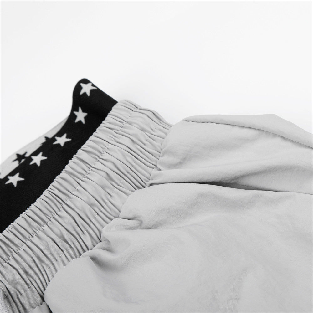 DAXUEN Wide-leg track pants with star graphics