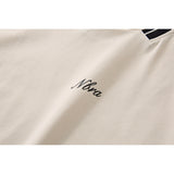 DAXUEN Oversized V-neck t-shirt with waffle knit texture and embroidery