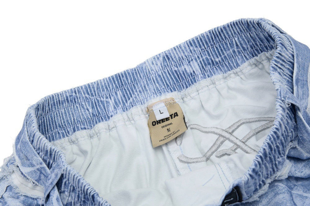 DAXUEN Oversized wide-leg pants with crinkled pattern and embroidery