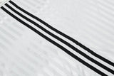 DAXUEN Short-sleeved polo shirt with vertical stripes and graphic text