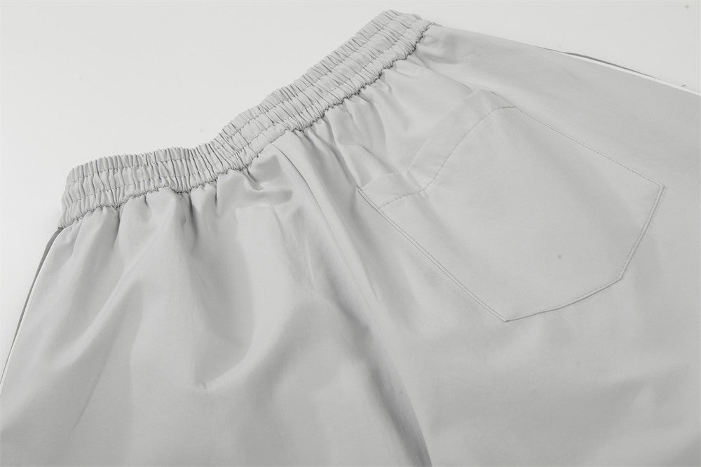 DAXUEN Wide-leg track pants with geometric color-blocked panels