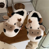 Model wearing the white Cow Slippers