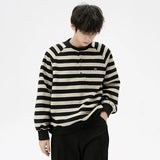Model wearing the black Striped Long-Sleeve Sweatshirt
