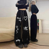 Model wearing the black Graffiti-Style Wide-Leg Pants