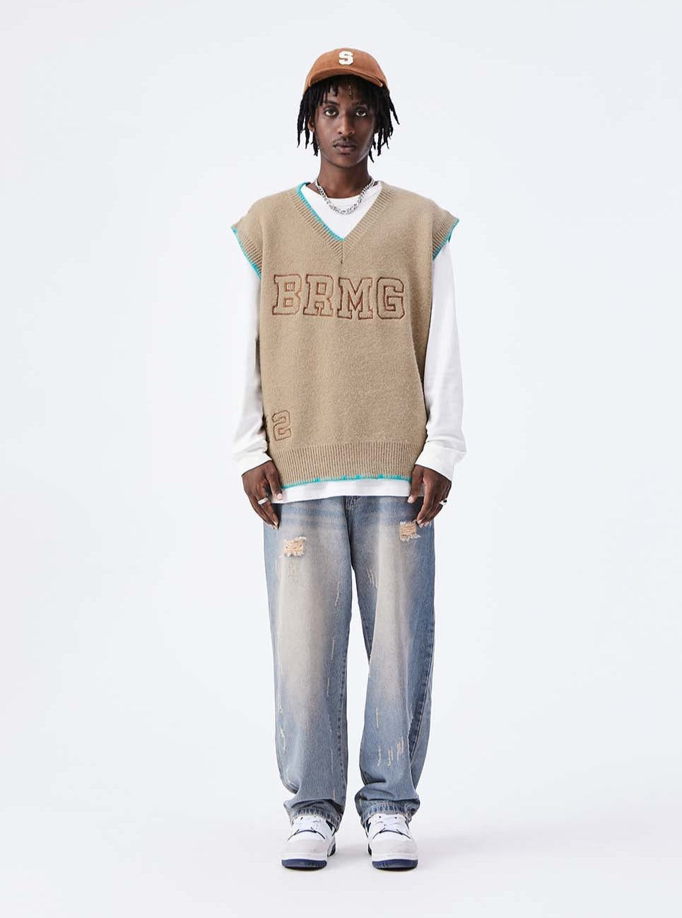 A guy wearing 72 knitted vest front view
