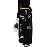 Model wearing the black Graffiti-Style Wide-Leg Pants
