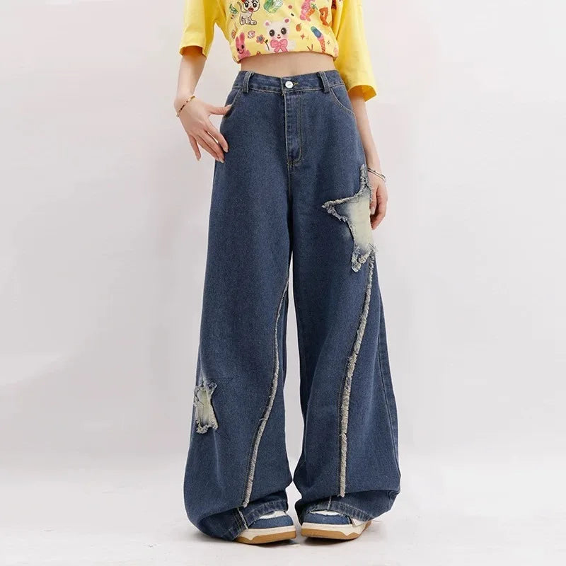 Model wearing the blue Distressed Star Patch Flare Jeans 
