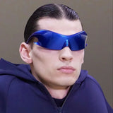 Model wearing the blue Futuristic Wraparound Sunglasses