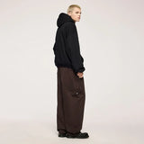 Model wearing the brown Fractal Elegance Cargo Pants
