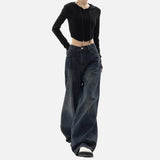 Model wearing the blue Ultra Baggy Denim Jeans in a gray background