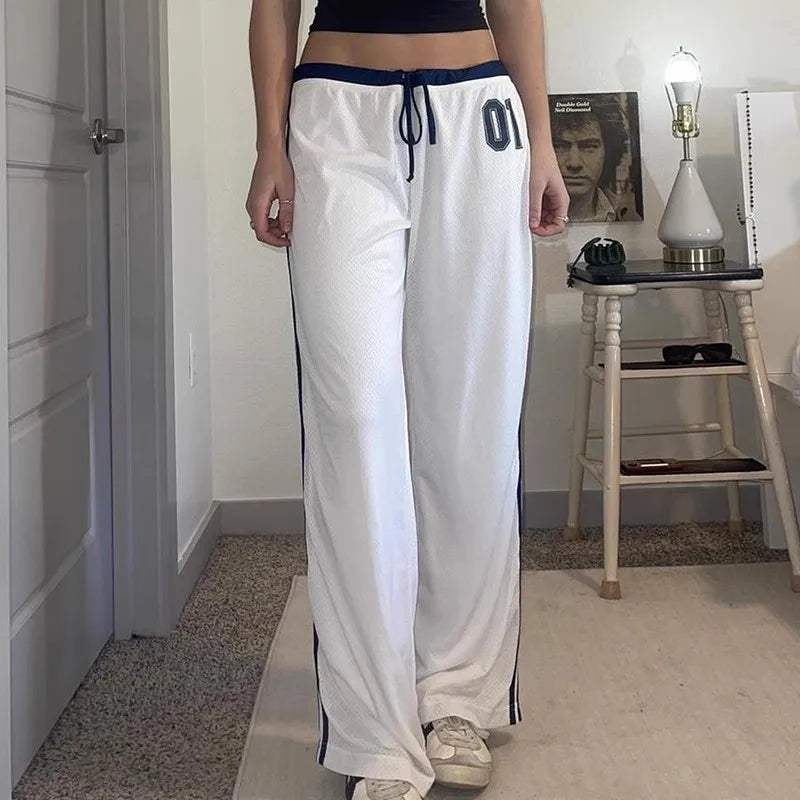 Model wearing the white Wide-Leg Athletic Pants 