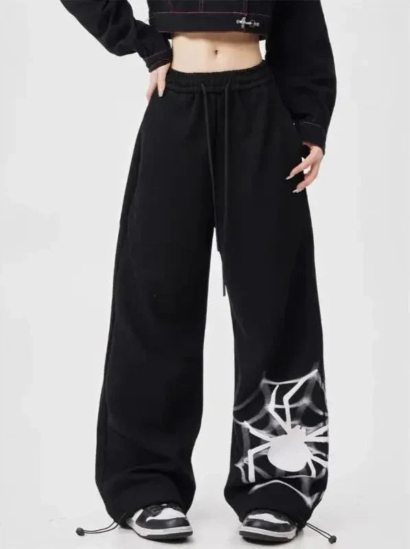 Model wearing the black Y2K Graphic Wide-Leg Sweatpants
