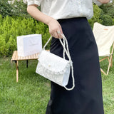 Model wearing the white Coquette Pearl Chain Shoulder Bag