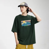 Model wearing the green Lazy Sunset Graphic T-Shirt