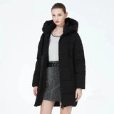 Model wearing the black Women's Padded Puffer Jacket in a gray background