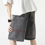 Stylish Spliced Button Zipper Ripped Shorts