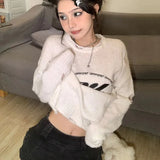 Model wearing the white interstellar Knit Reverie Sweater