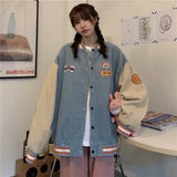 Model wearing the blue Vintage Embroidery Loose Varsity Jacket in a room