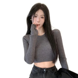 Model wearing the gray Long-Sleeve Ribbed Crop Sweater