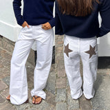 Models Wearing the Y2K Star-Gazer Jeans