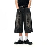 Model wearing the black Edgy Chain Denim Shorts 