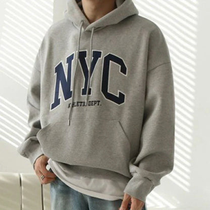 Model wearing the gray Urban Nomad Hoodie 