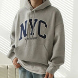 Model wearing the gray Urban Nomad Hoodie 