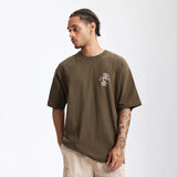 Model wearing the olive green Character Platform T-Shirt 
