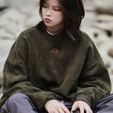 Model wearing the green Y2K Peak Drift Sweatshirt