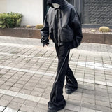 Model wearing the black Zippered Cargo Pants