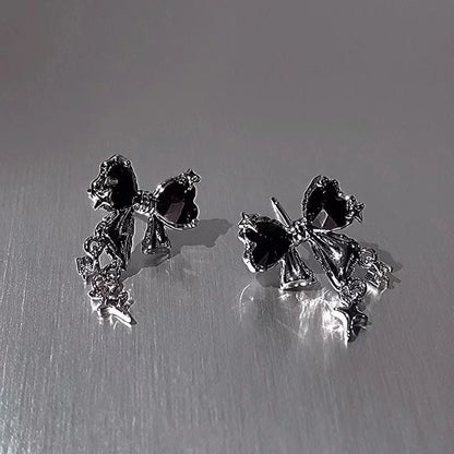 Front view of the black Gleaming Charm Drops Earrings