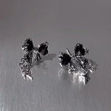 Front view of the black Gleaming Charm Drops Earrings