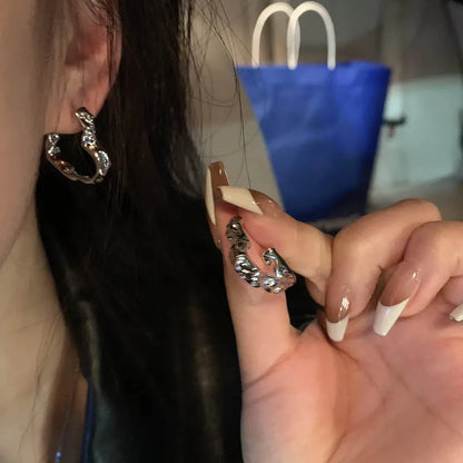 Model wearing the Waveform Elegance Earrings