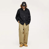 Model wearing the khaki Fractal Elegance Cargo Pants
