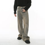 Model wearing the beige Wide-Leg Distressed Baggy Jeans