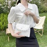 Model wearing the white Coquette Pearl Chain Shoulder Bag
