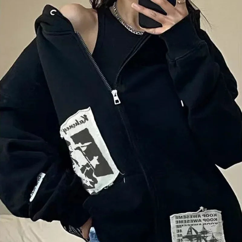 Model wearing the black Graphic Patchwork Zip-Up Sweatshirt