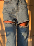Model wearing the blue Embellished Baddie Cut-Out Jeans